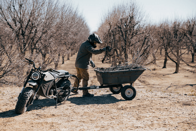 Volcon Grunt EVO electric motorcycle with person doing lifestyle block chores image